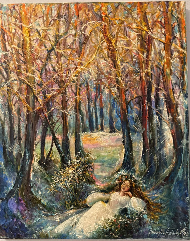 A woman in a flowing white dress reclines beneath tall trees, her eyes closed and a wreath of flowers in her hair. Golden branches arch above dark blue trunks and a softly coloured path receding into the forest.
