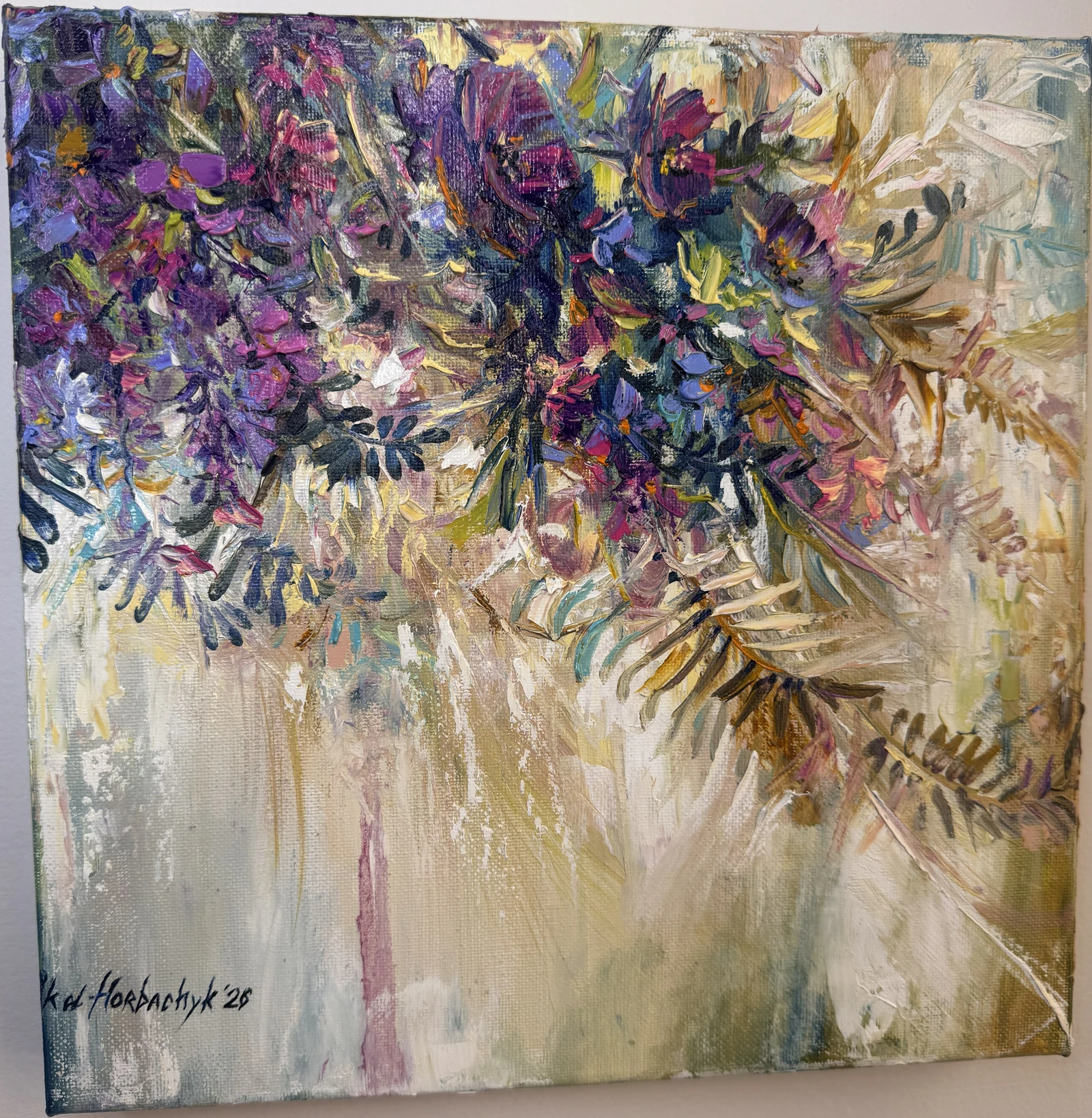 Violet, purple and deep blue blossoms gather across the upper canvas, with trailing leaves reaching into a pale gold and cream ground. Thick brushstrokes contrast with long, translucent passages of colour.