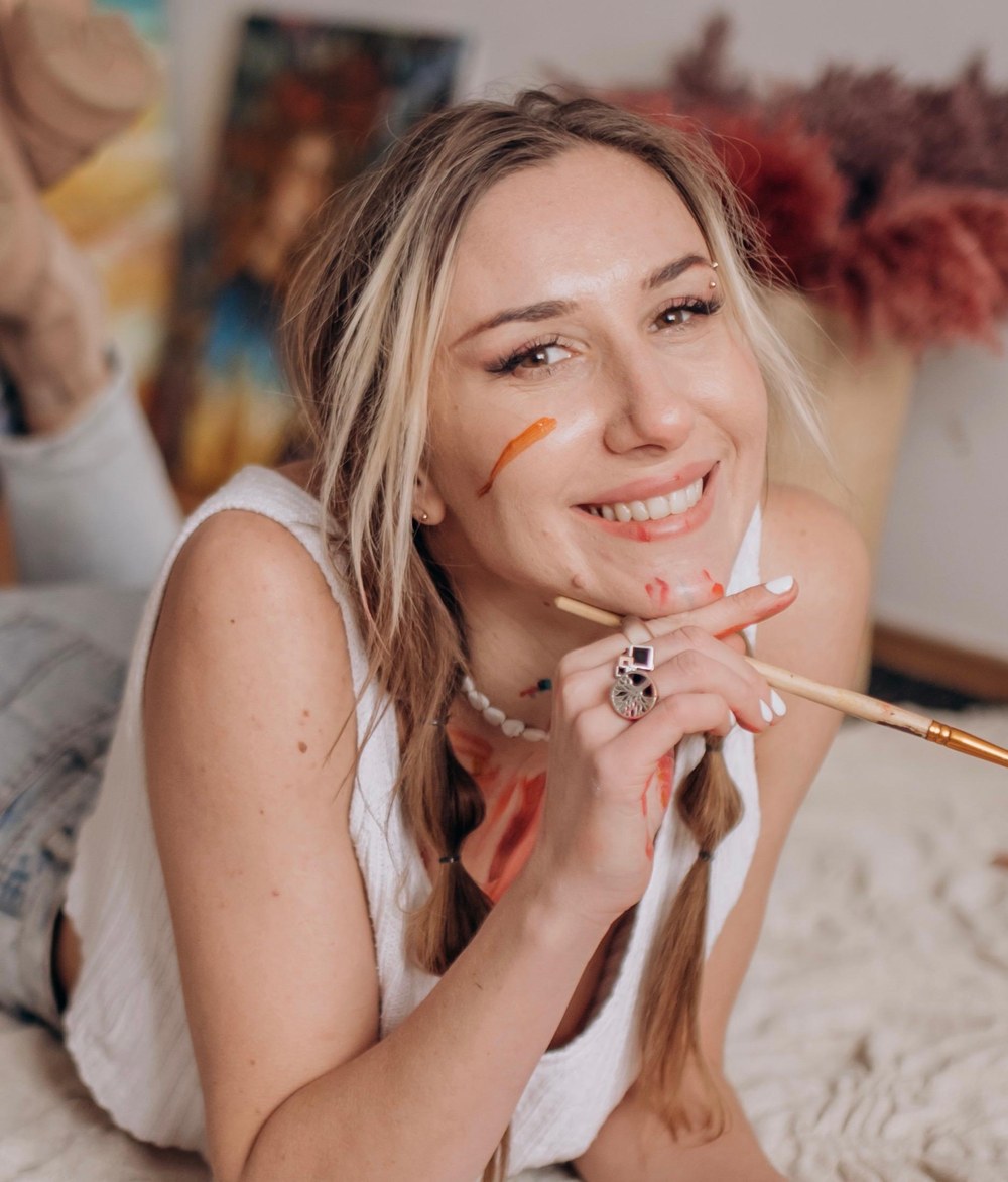 Liudmyla Horbachyk with a paintbrush in her studio