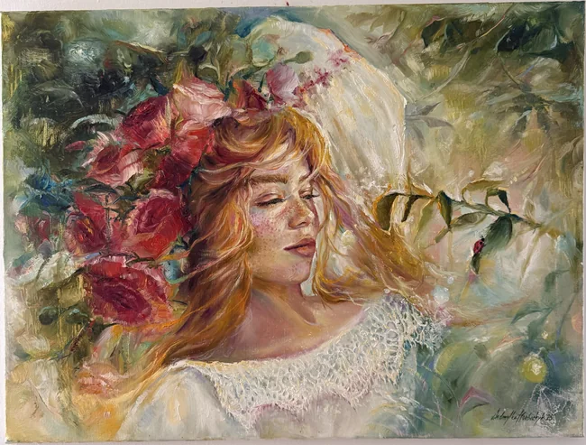 A red-haired woman appears among warm red blossoms and translucent green foliage, with lace-like white textures and small accents of bright colour.